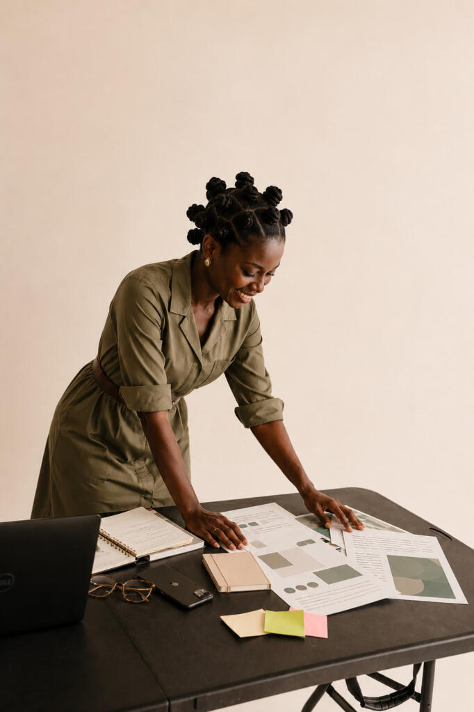 a professional woman going through documents on a desk